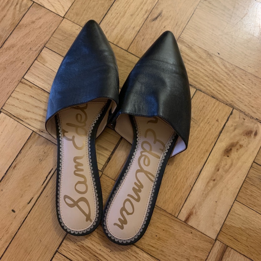 Black leather slide-on pointed toe flats